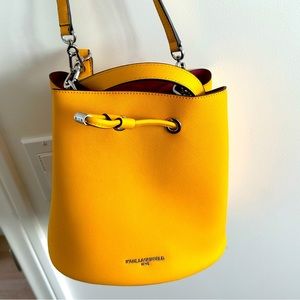 Yellow, medium sized bucket bag. Like NEW. No scratches or scuff marks.